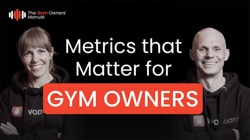 Viv and George of WodBoard smiling beside the text "Metrics that Matter for Gym Owners", thumbnail for The Gym Owners' Manual