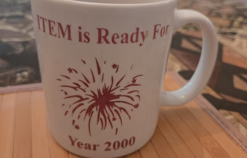 Mug with the slogan "ITEM is Ready For Year 2000" and a celebratory firework clip art.